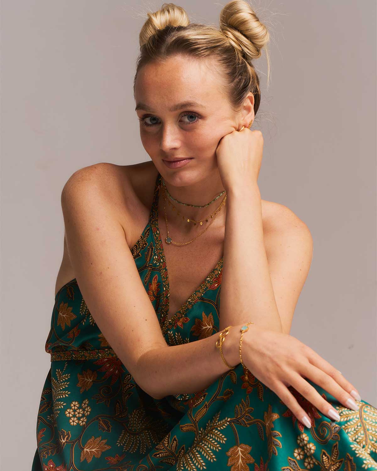 Gold necklace with a half faceted aqua chalcedony gemstone pendant