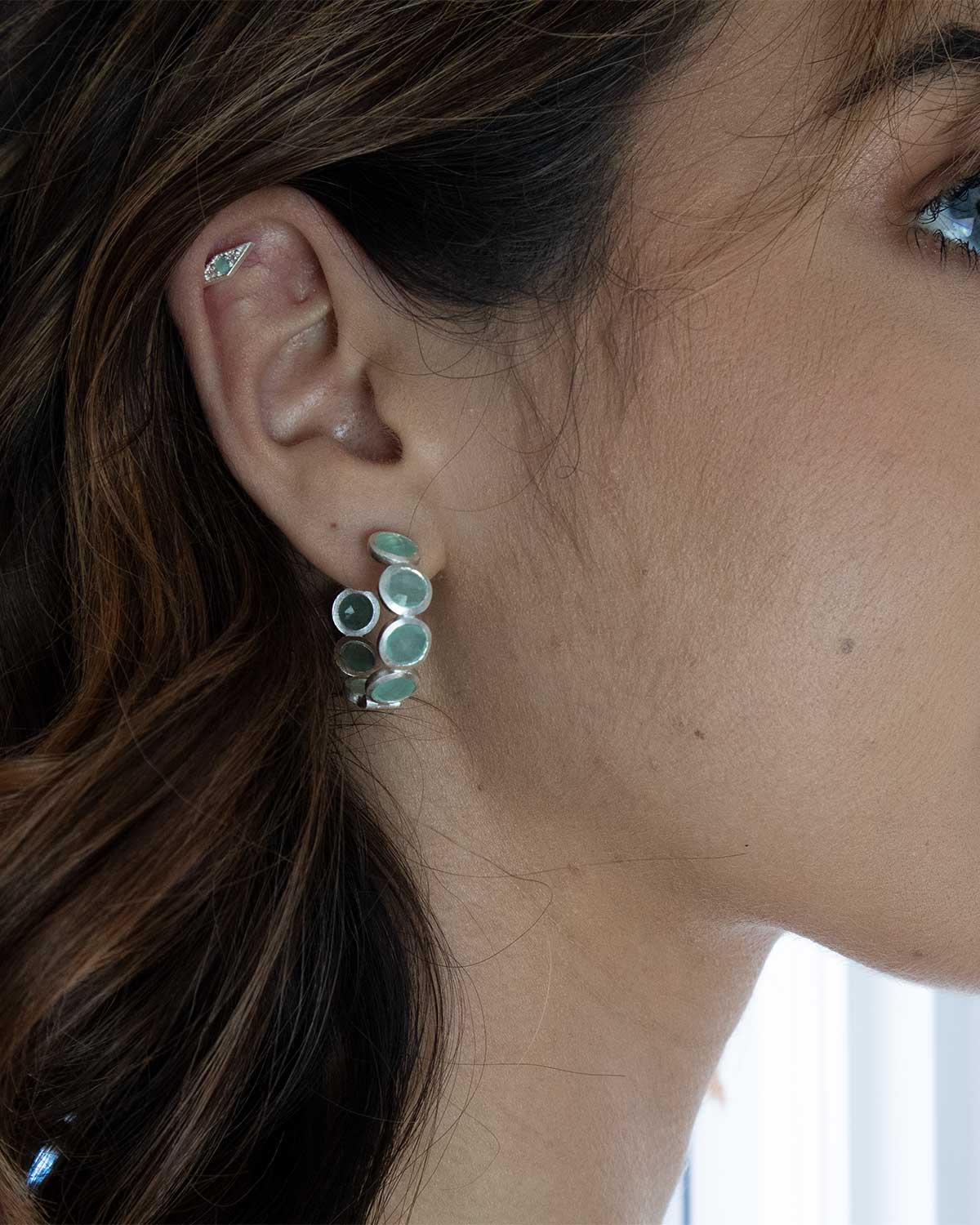 Lightweight silver hoop earrings with aqua gemstones for everyday wear
