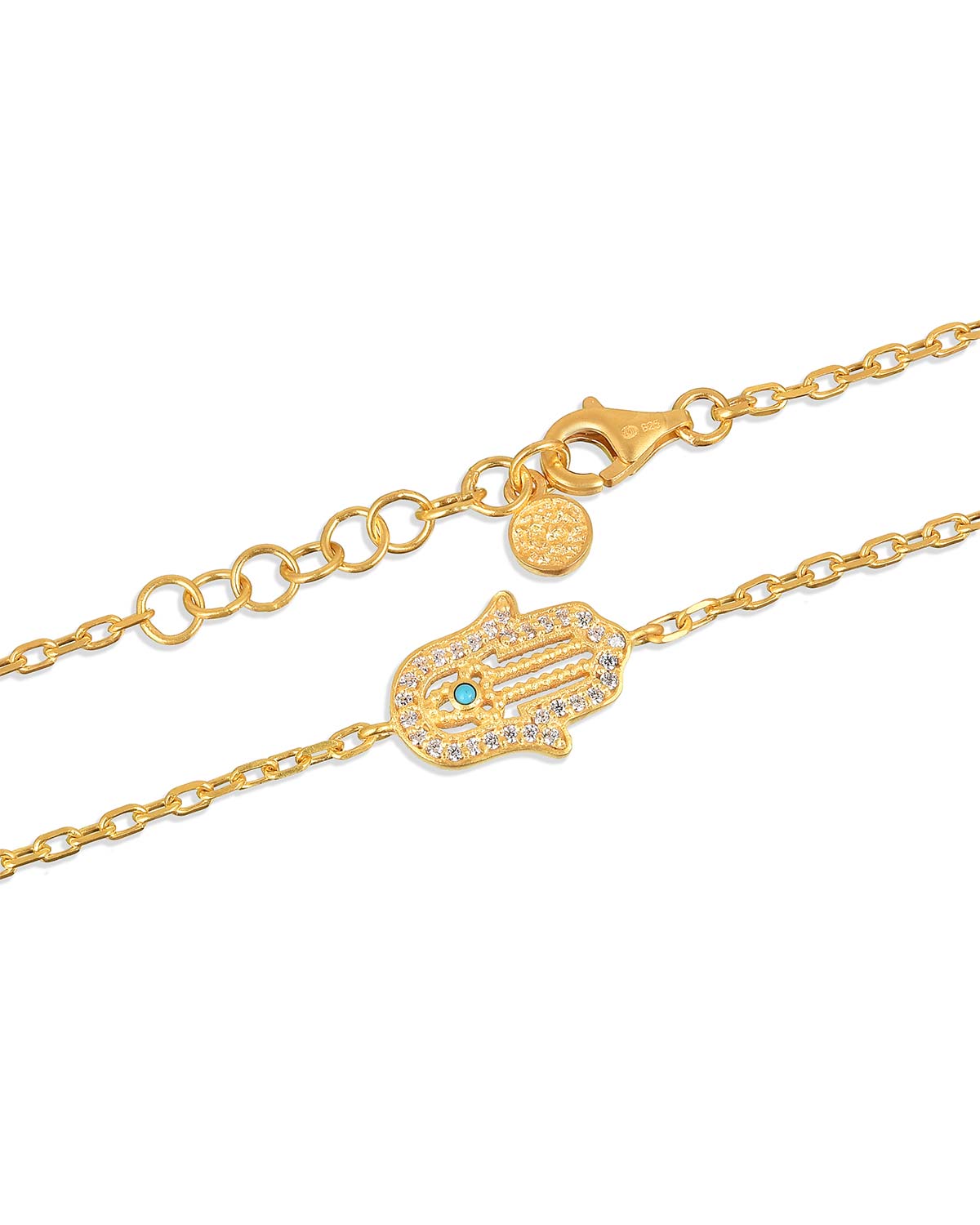 Close-up of hand charm on gold bracelet with lab diamonds and turquoise accent