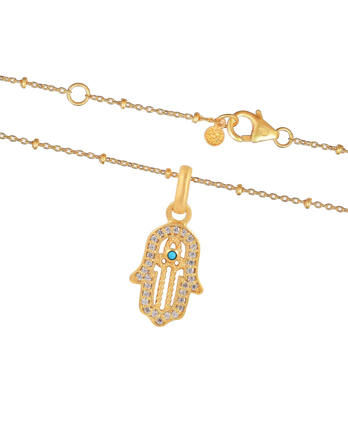 Detailed view of turquoise gemstone and tiny lab diamonds on gold necklace pendant