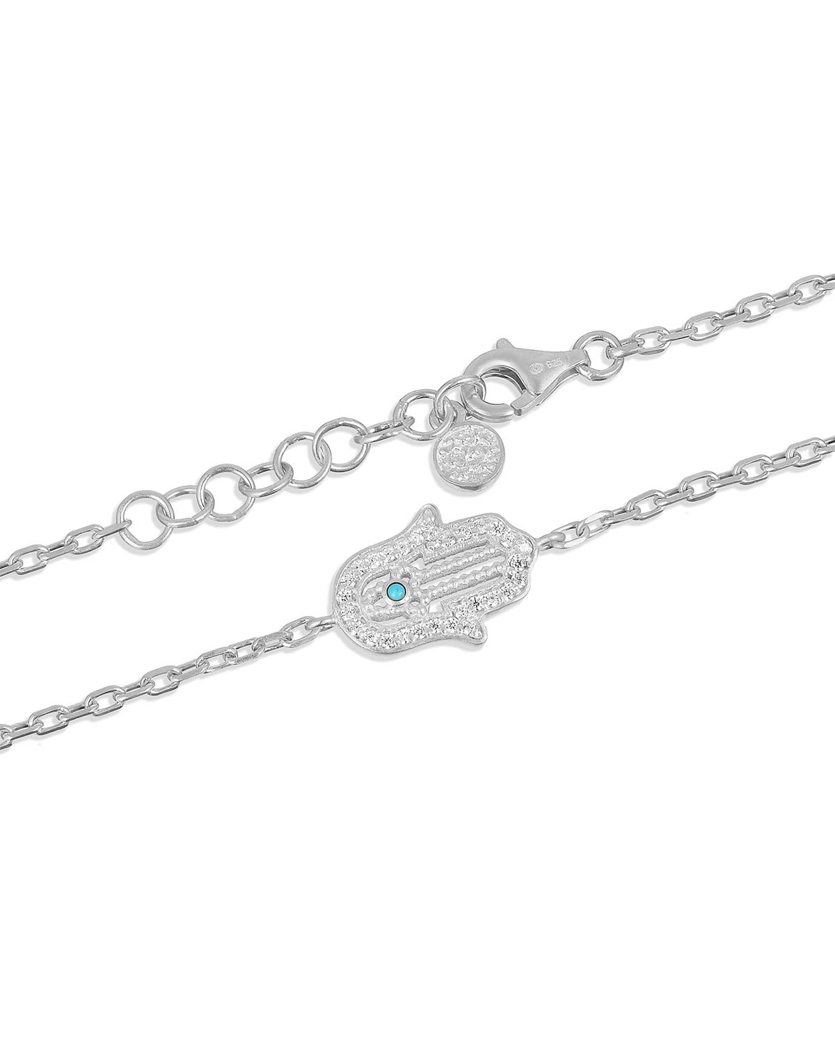 Detailed view of turquoise gemstone and lab diamonds on the hand charm