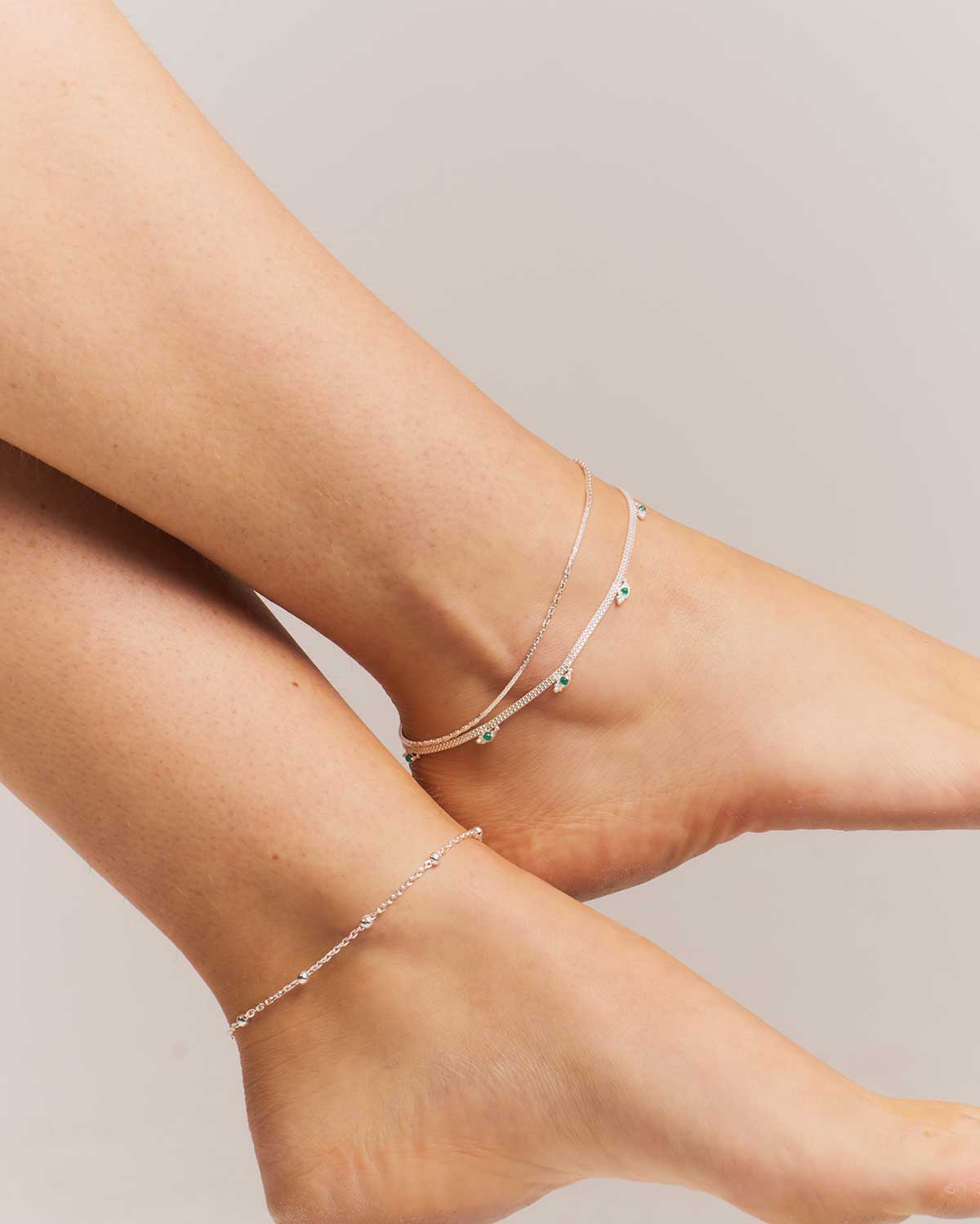 Close-up of a sterling silver adjustable anklet with polished details