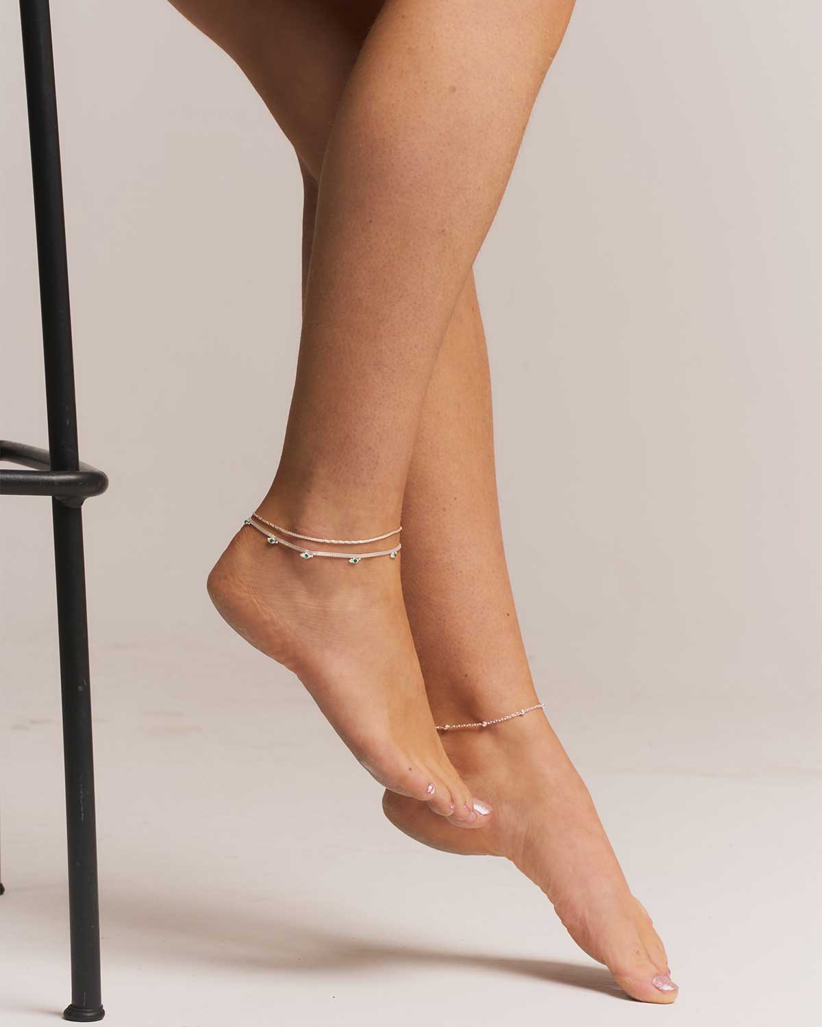 Model wearing a sterling silver adjustable anklet