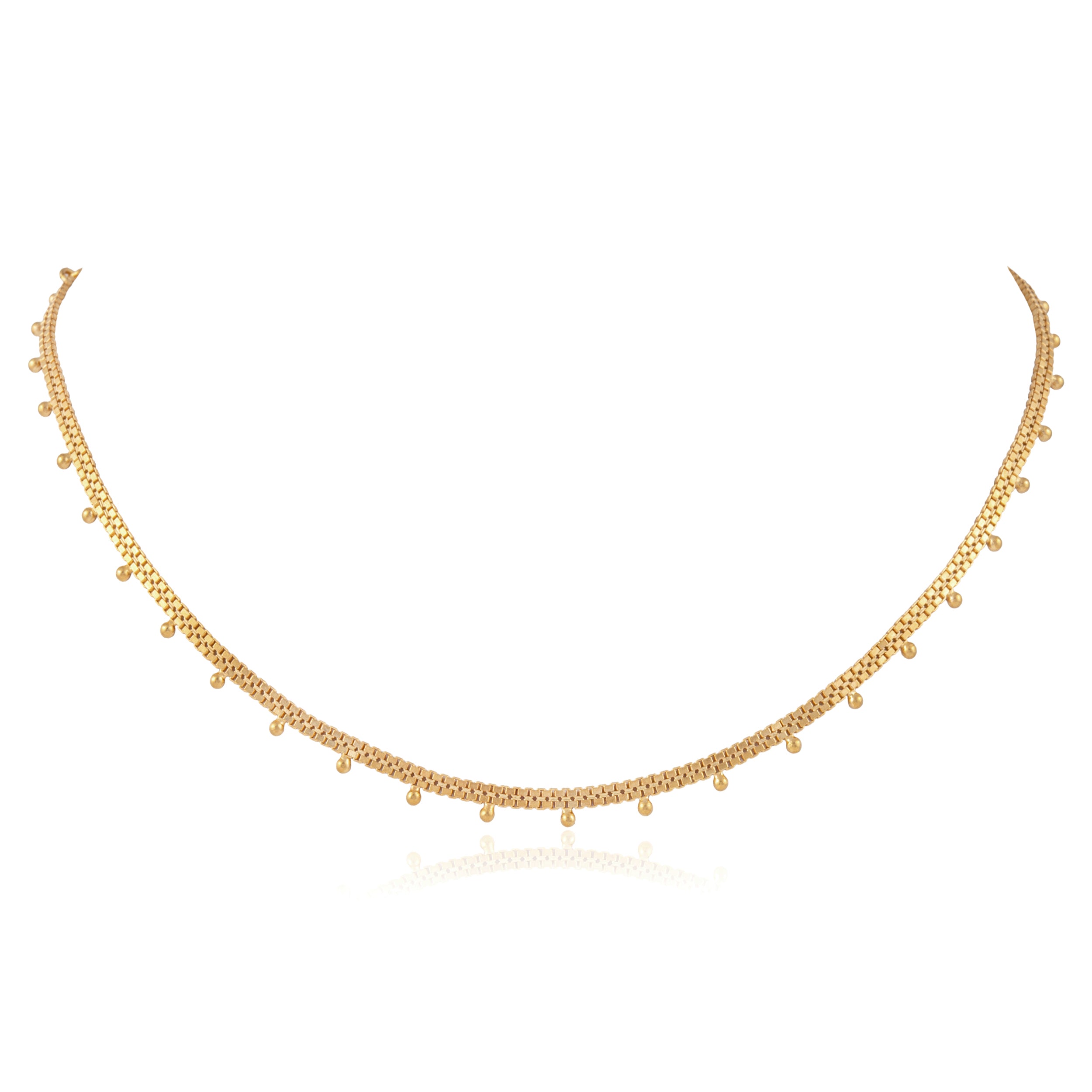 Detailed view of tiny handmade gold beads on necklace