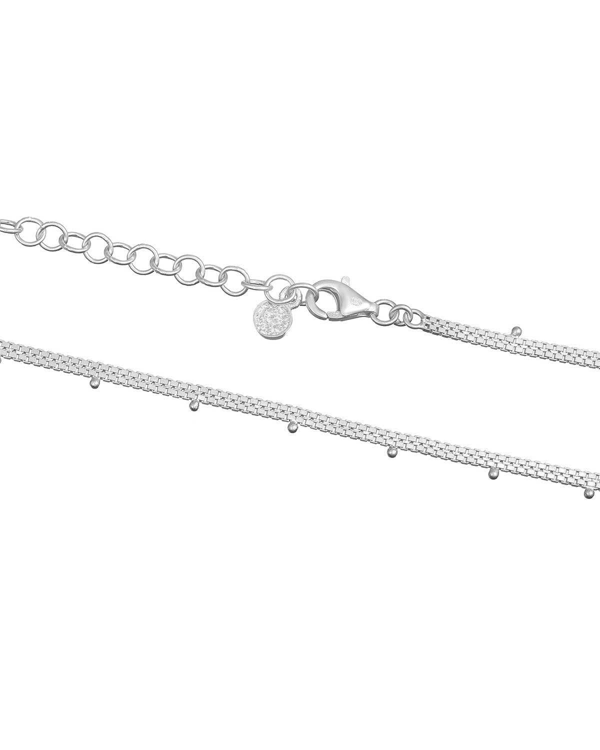 Delicate sterling silver necklace with tiny beads creating a refined look