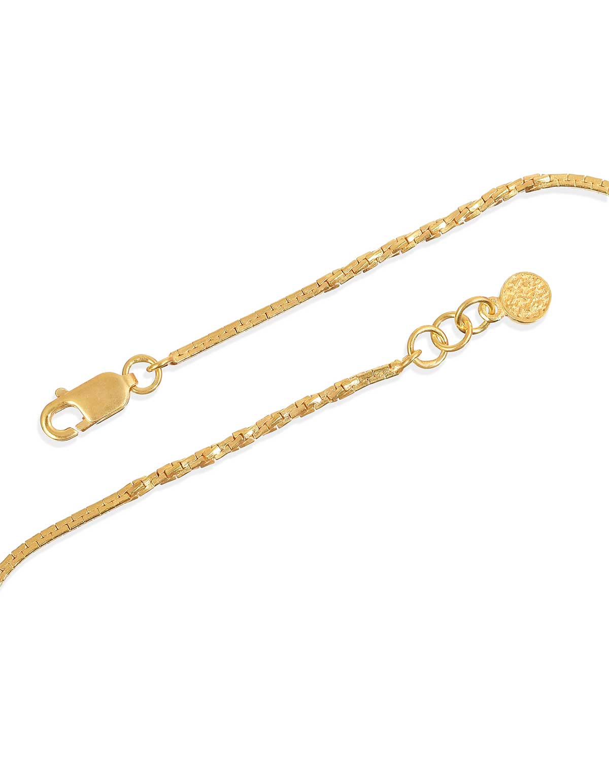 Close-up of gold adjustable anklet with dual texture detailing