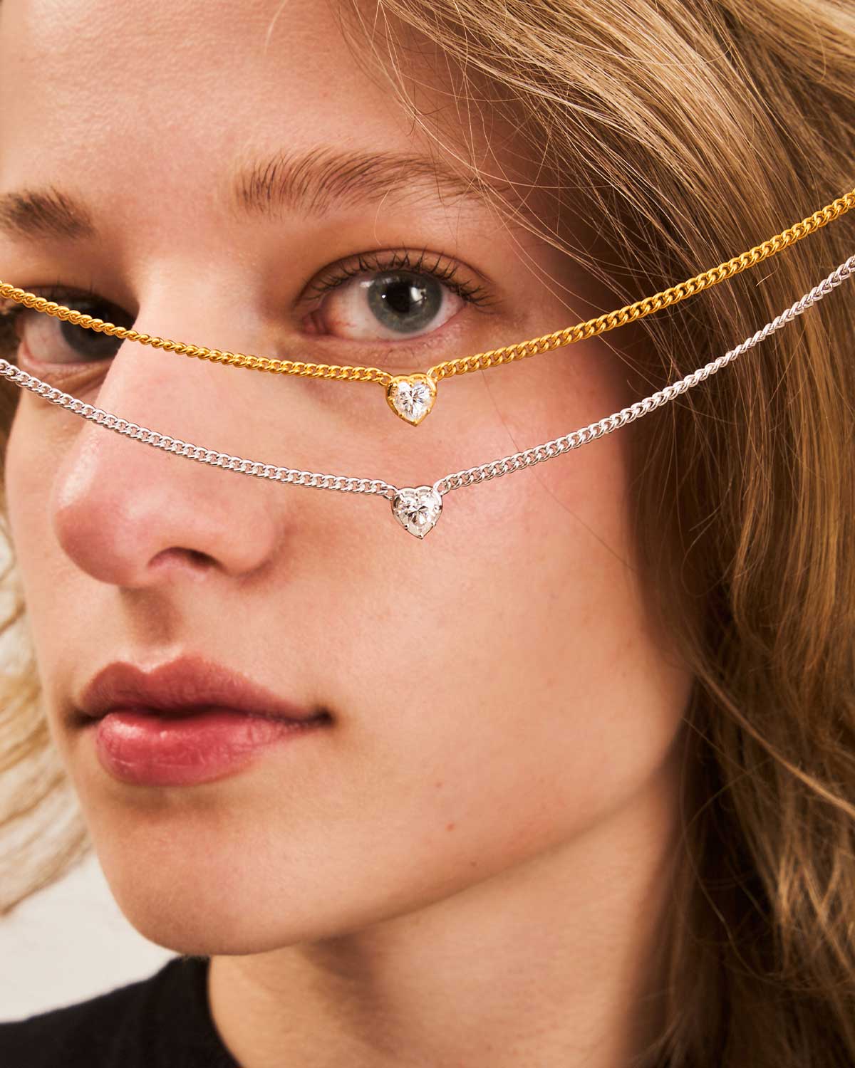 Silver necklace with a diamond heart pendant, a timeless symbol of love and April’s birthstone