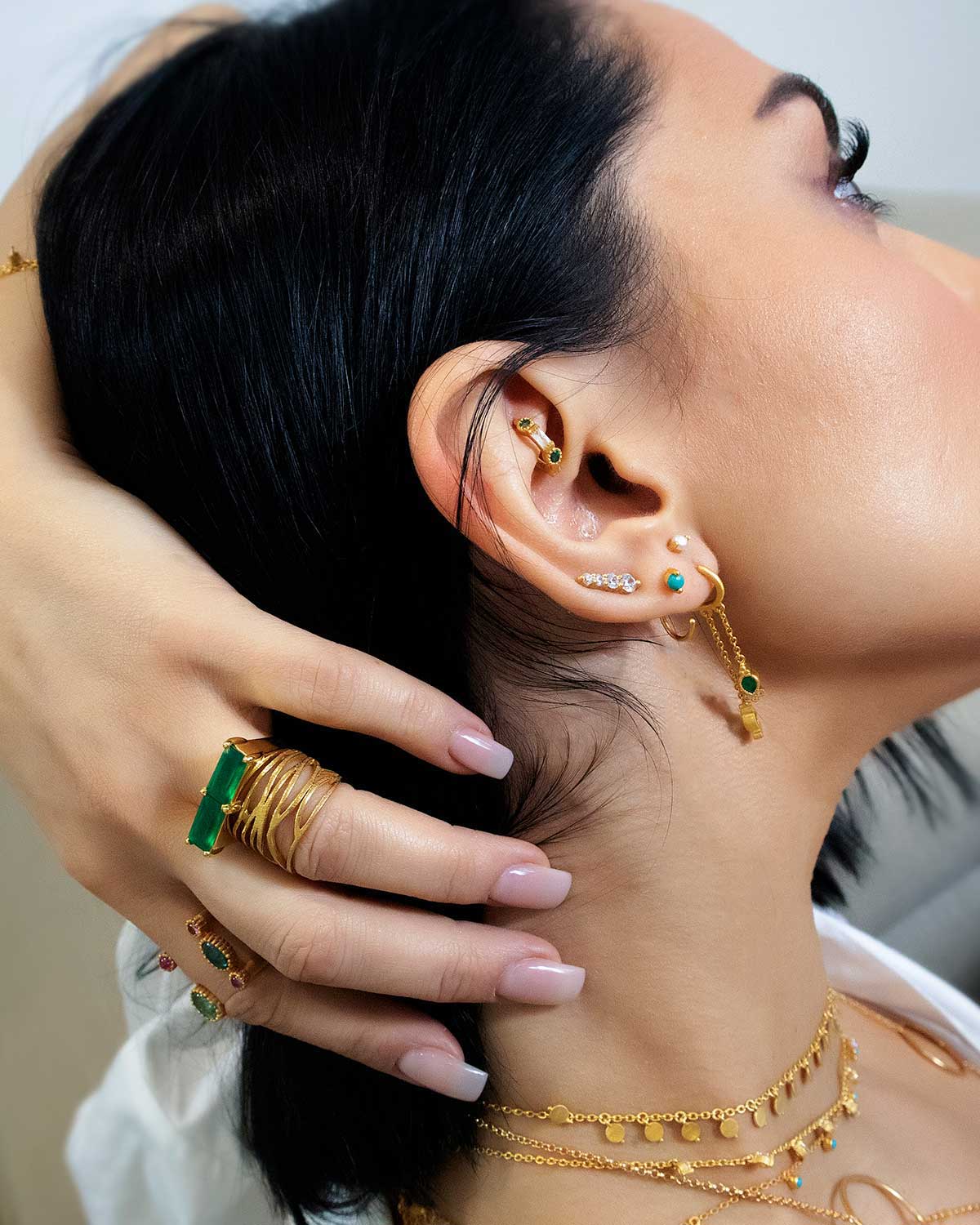 Detailed view of green onyx gemstone set in a bold gold ring