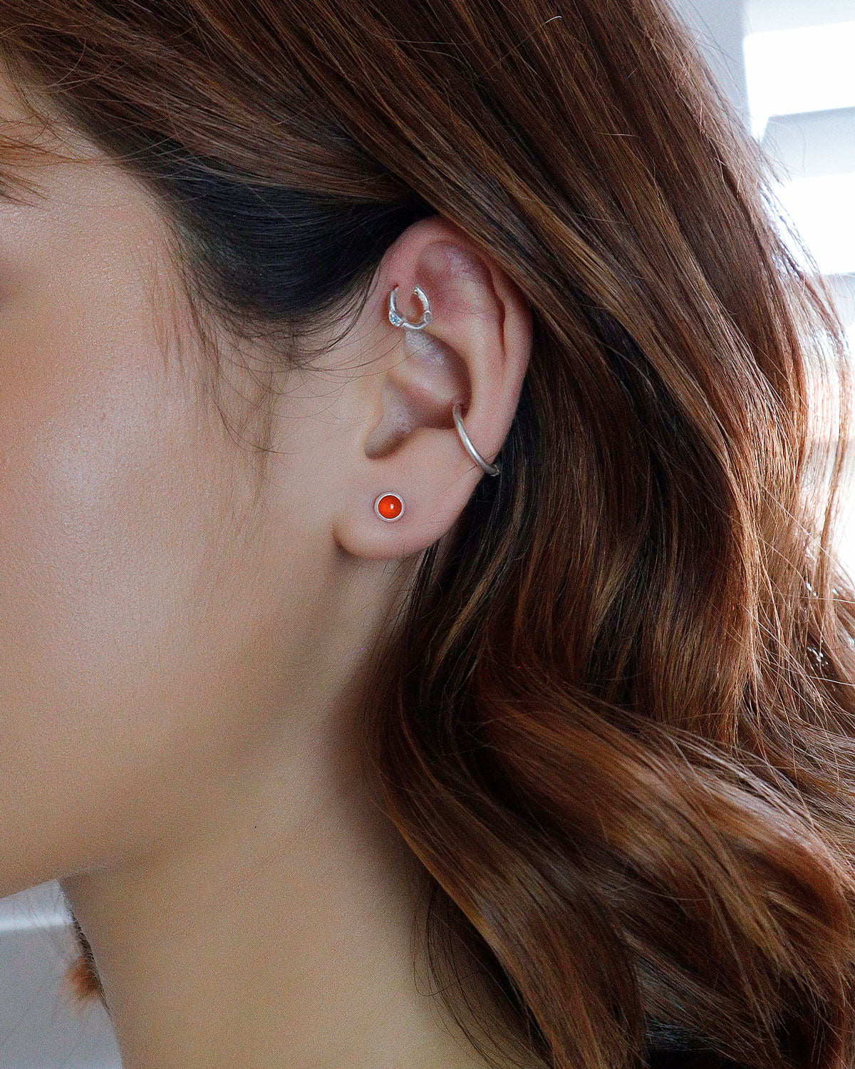 Model wearing carnelian gemstone stud earrings for an everyday look