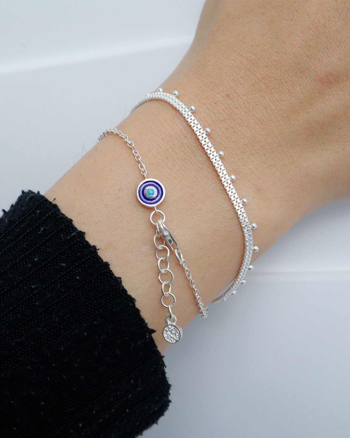 Silver bracelet with evil eye design and polished finish