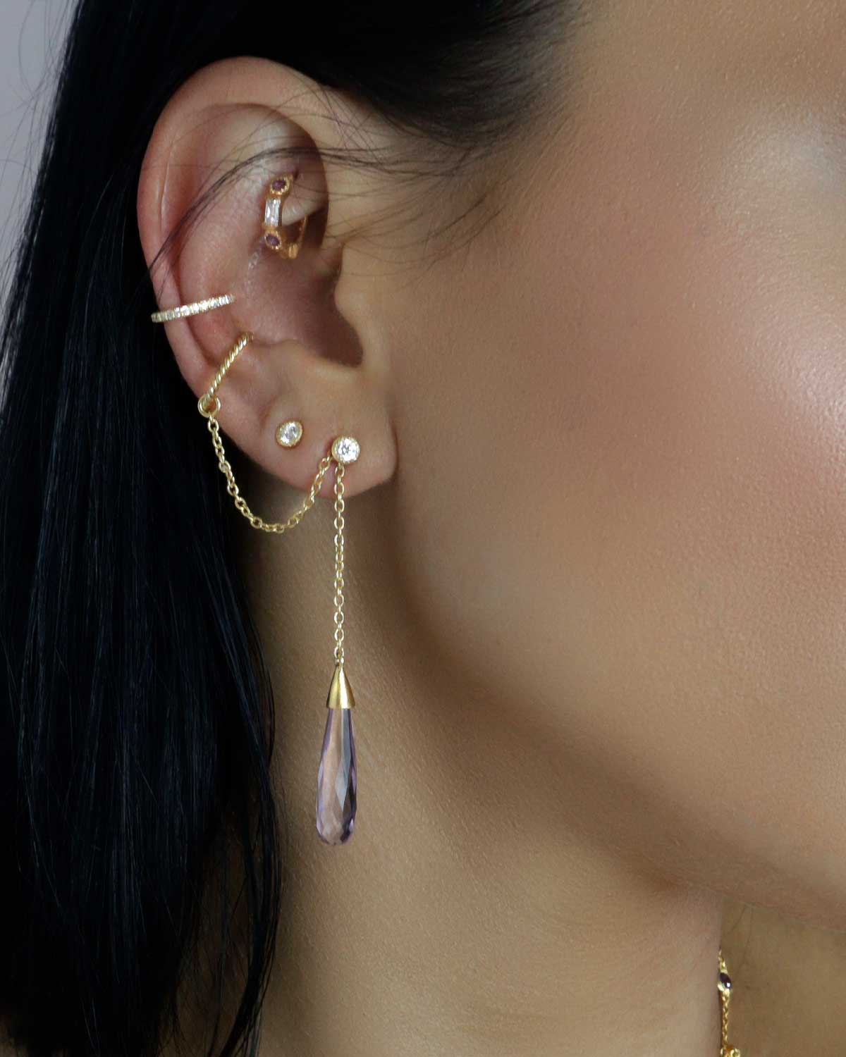 Close-up of green amethyst earrings set in sterling silver