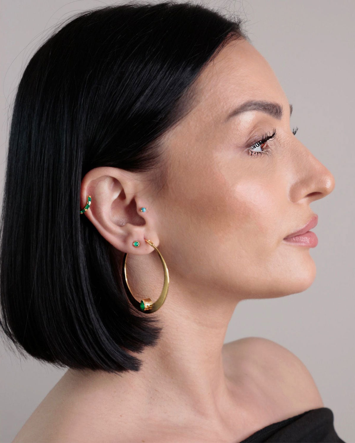 Lightweight large gold hoop earrings with green onyx gemstones