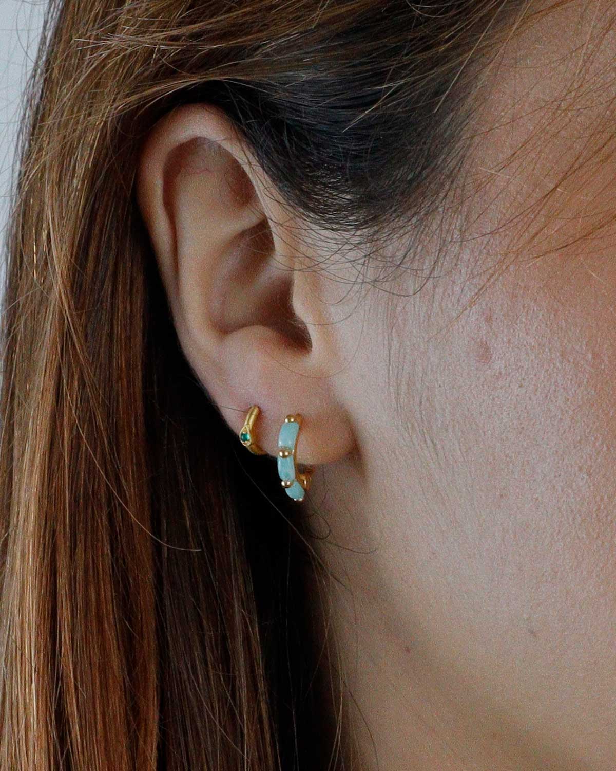Amazonite gold mini hoop earrings styled in a layered ear stack with other jewellery