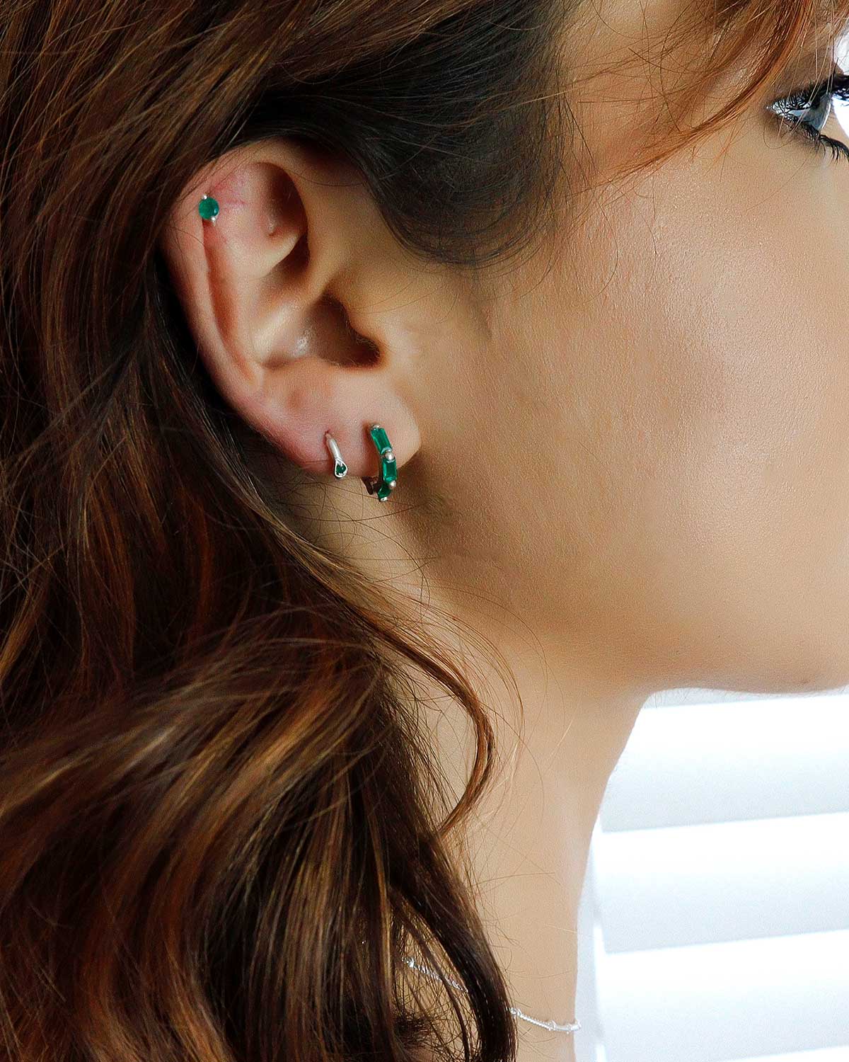 Gold mini hoop earrings with baguette-cut emerald green onyx gemstones