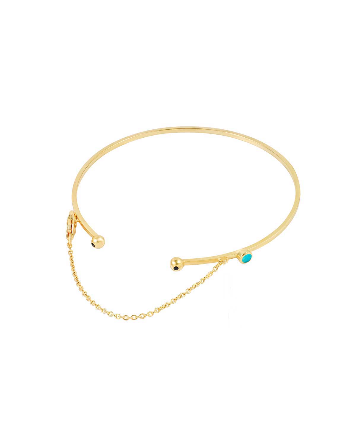 Close-up of gold arm cuff texture and gemstone arrangement