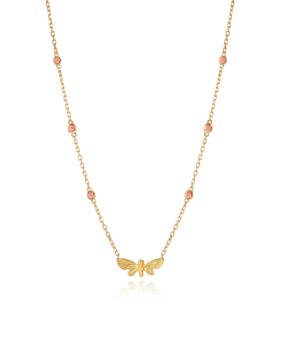 Close-up showing butterfly design and gemstone detailing on gold necklace