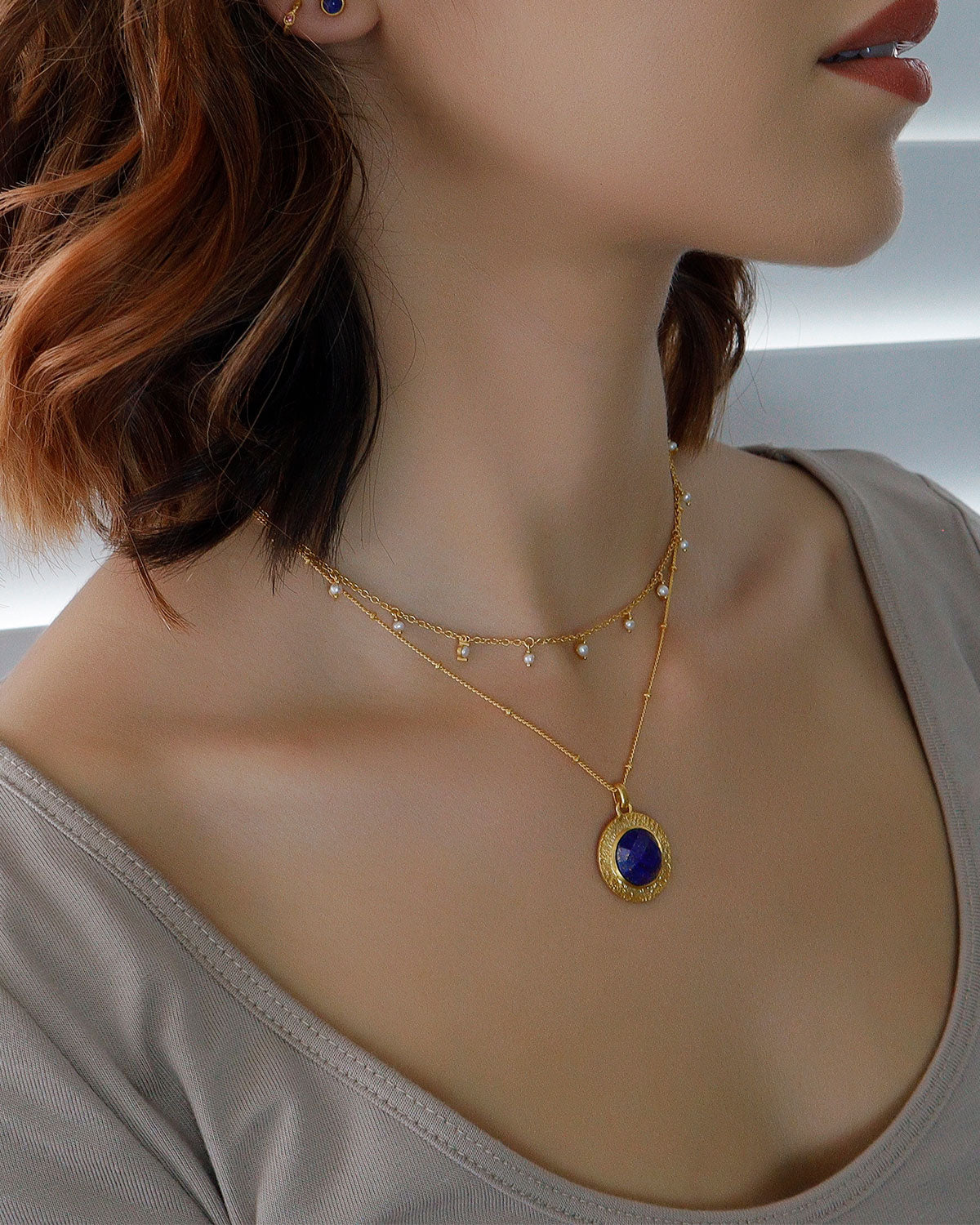 Gold necklace with micro bead chain and lapis lazuli pendant