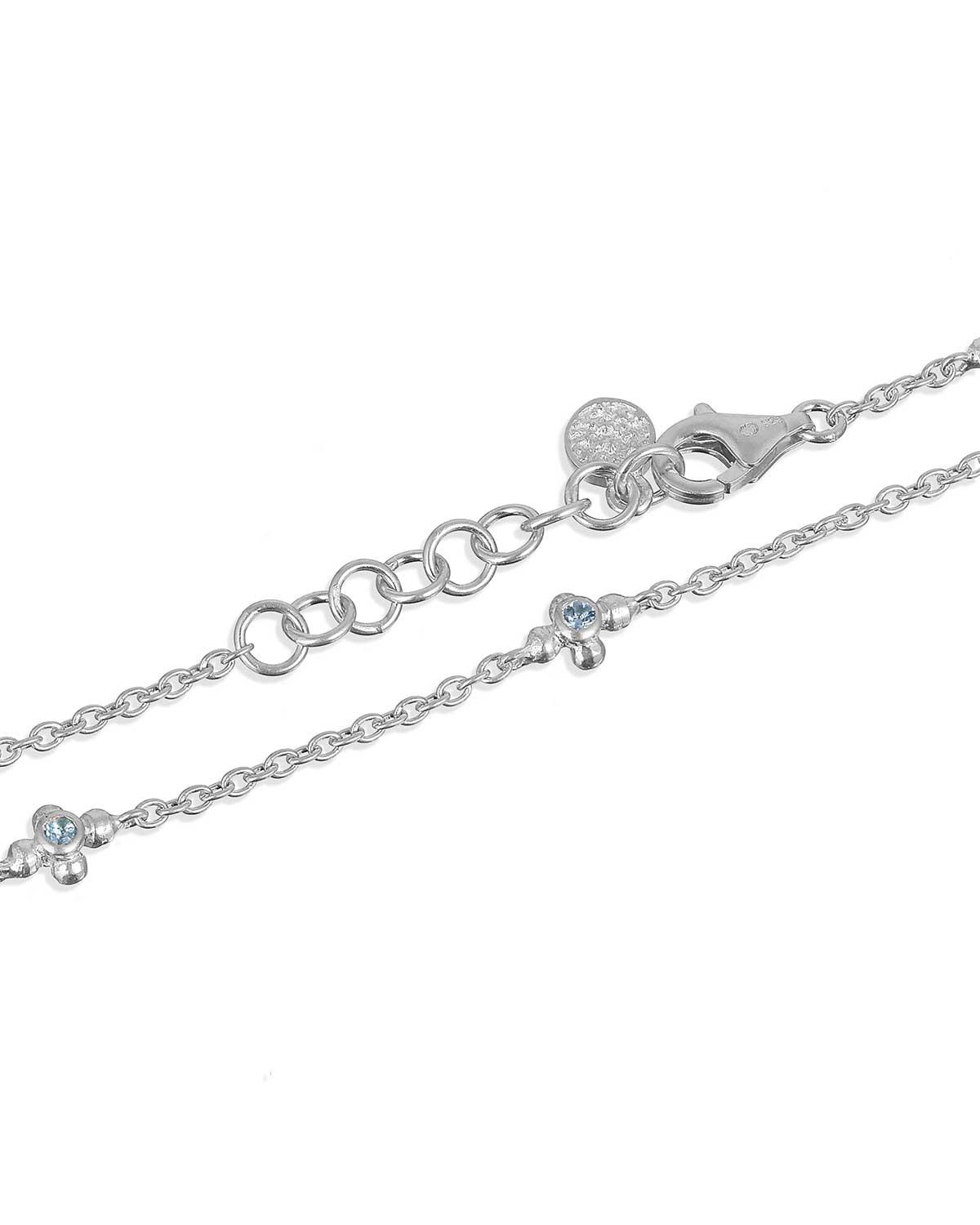 Silver bracelet with December blue topaz birthstone and April diamond birthstone details