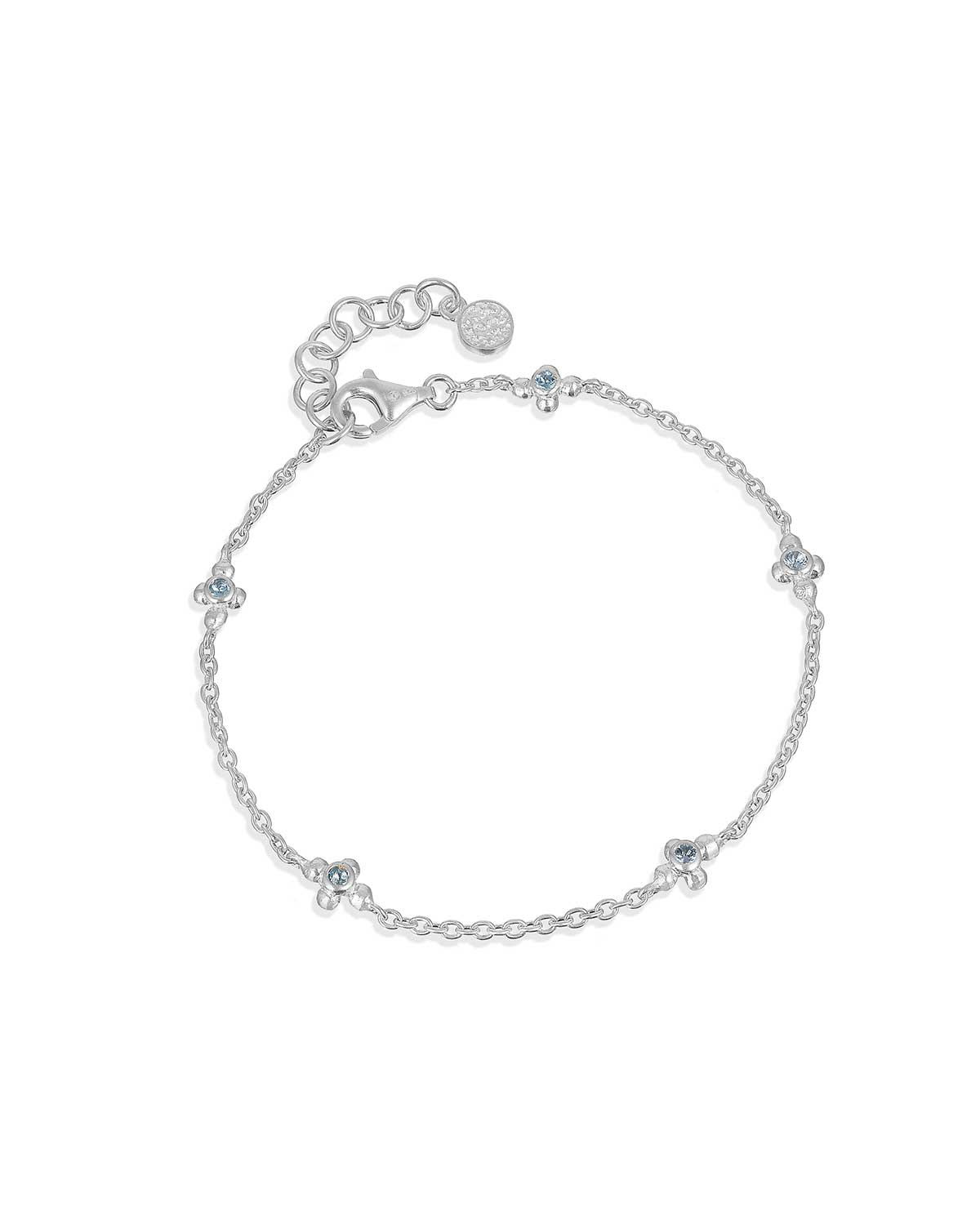 Silver bracelet with blue topaz gemstones and moissanite diamonds in a delicate design