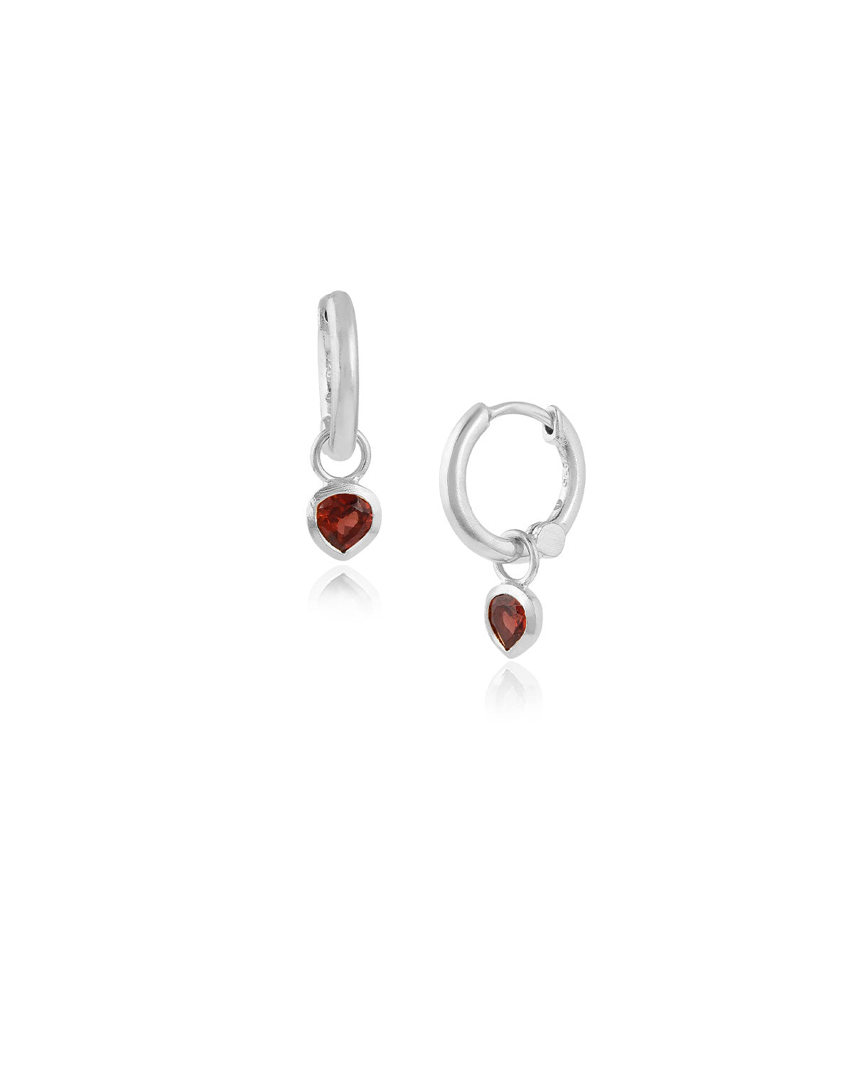 Silver mini hoop earrings with garnet heart charms and a polished finish