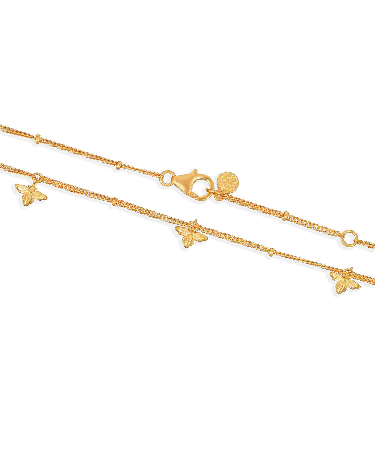 Adjustable clasp detail on a gold necklace with handcrafted bee charms