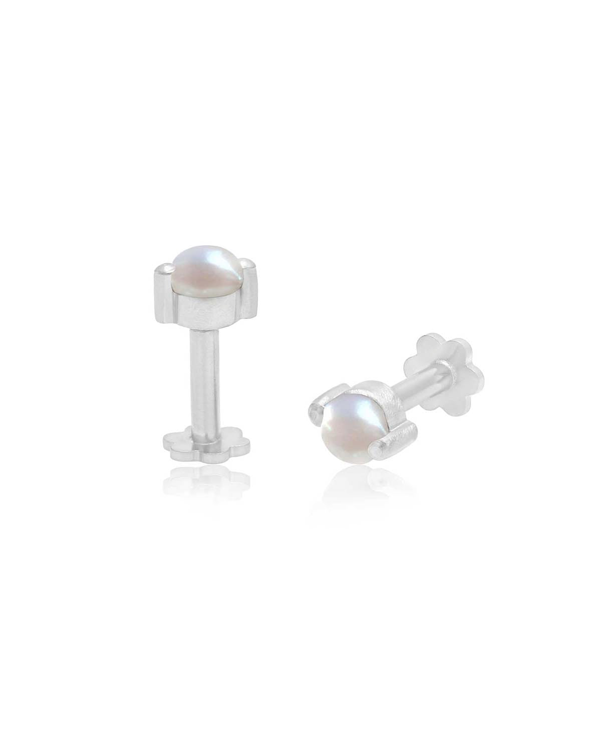 Close-up of mini silver studs with natural pearl detail