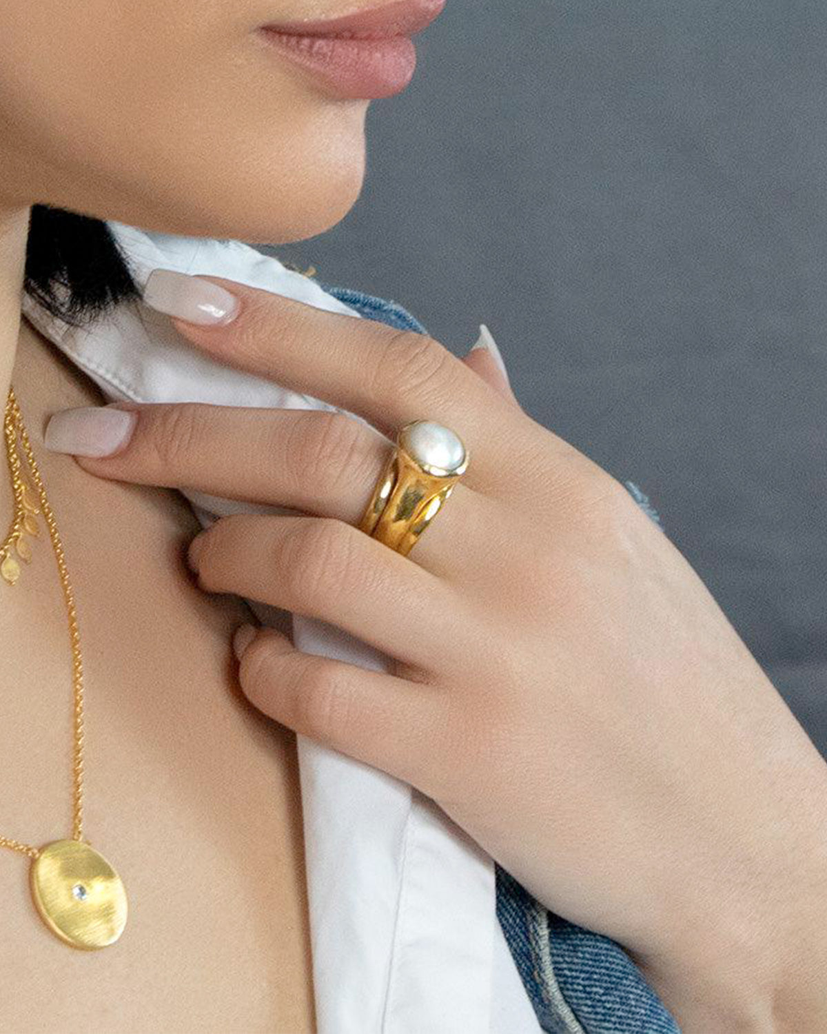 Close-up of silver ring featuring a natural baroque pearl