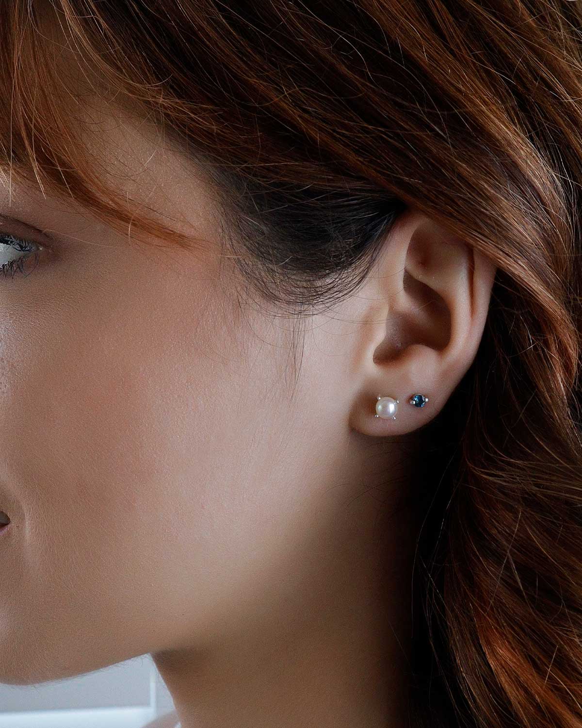 Side angle of sterling silver pearl stud earrings