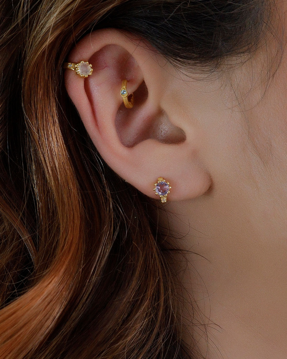 Gold huggie earrings with pink amethyst and labradorite stones for balance and style