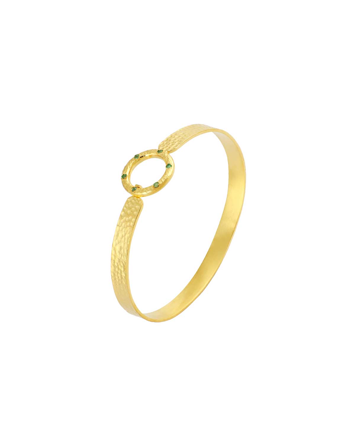 Gold flexible bangle worn on the wrist with a hammered finish and gemstones