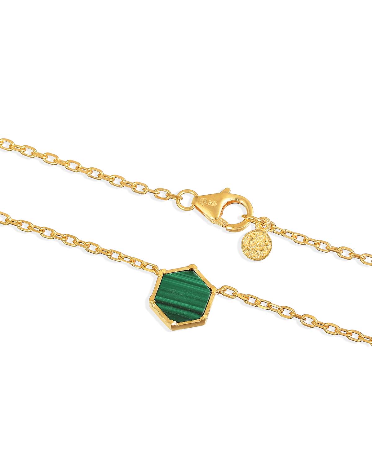 Detailed view of the green malachite gemstone with natural wave texture