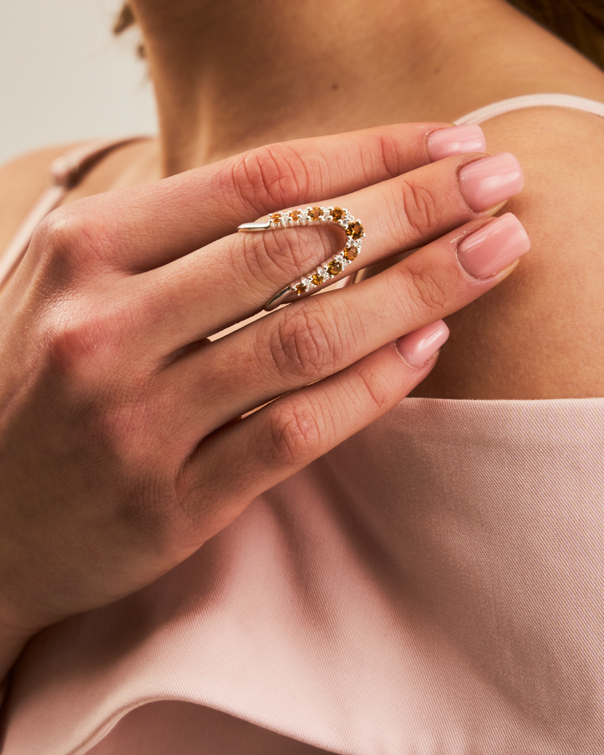 Gold citrine ring shown from multiple angles highlighting its unique design