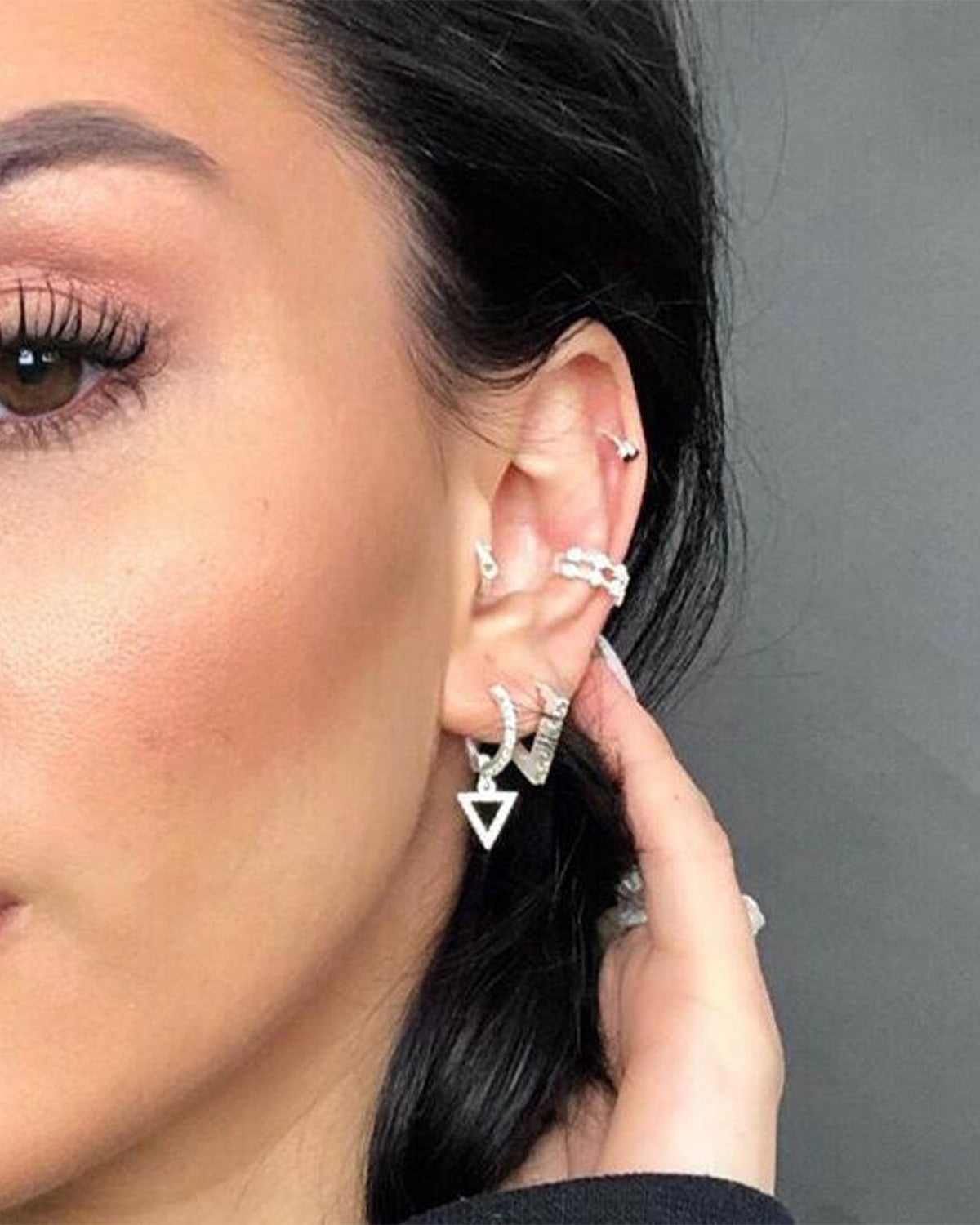 Close-up of silver mini hoops with sparkling cubic zirconia crystals