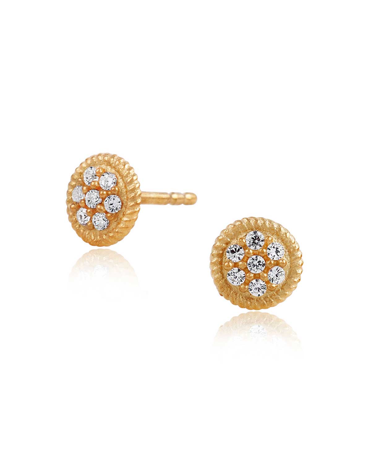 Tiny rose gold stud earrings with a sparkly circular design and matte finish