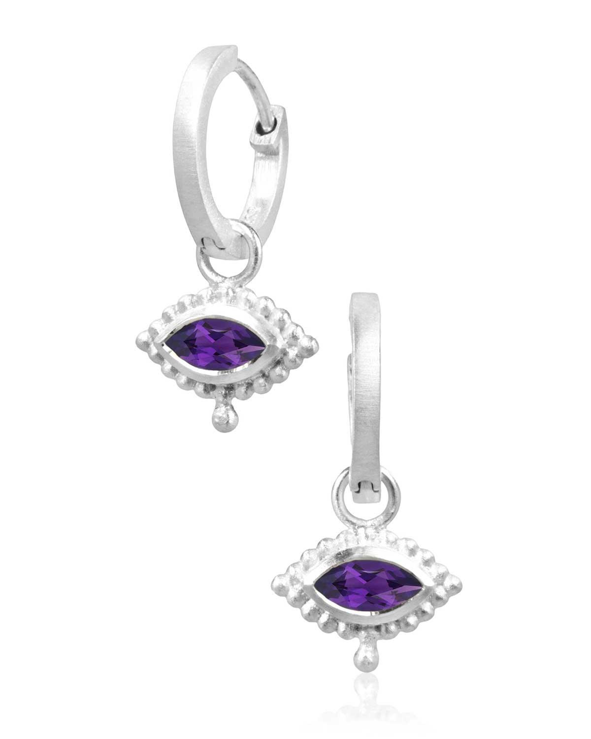 Close-up of silver mini hoops with hand-cut amethyst gemstone charm