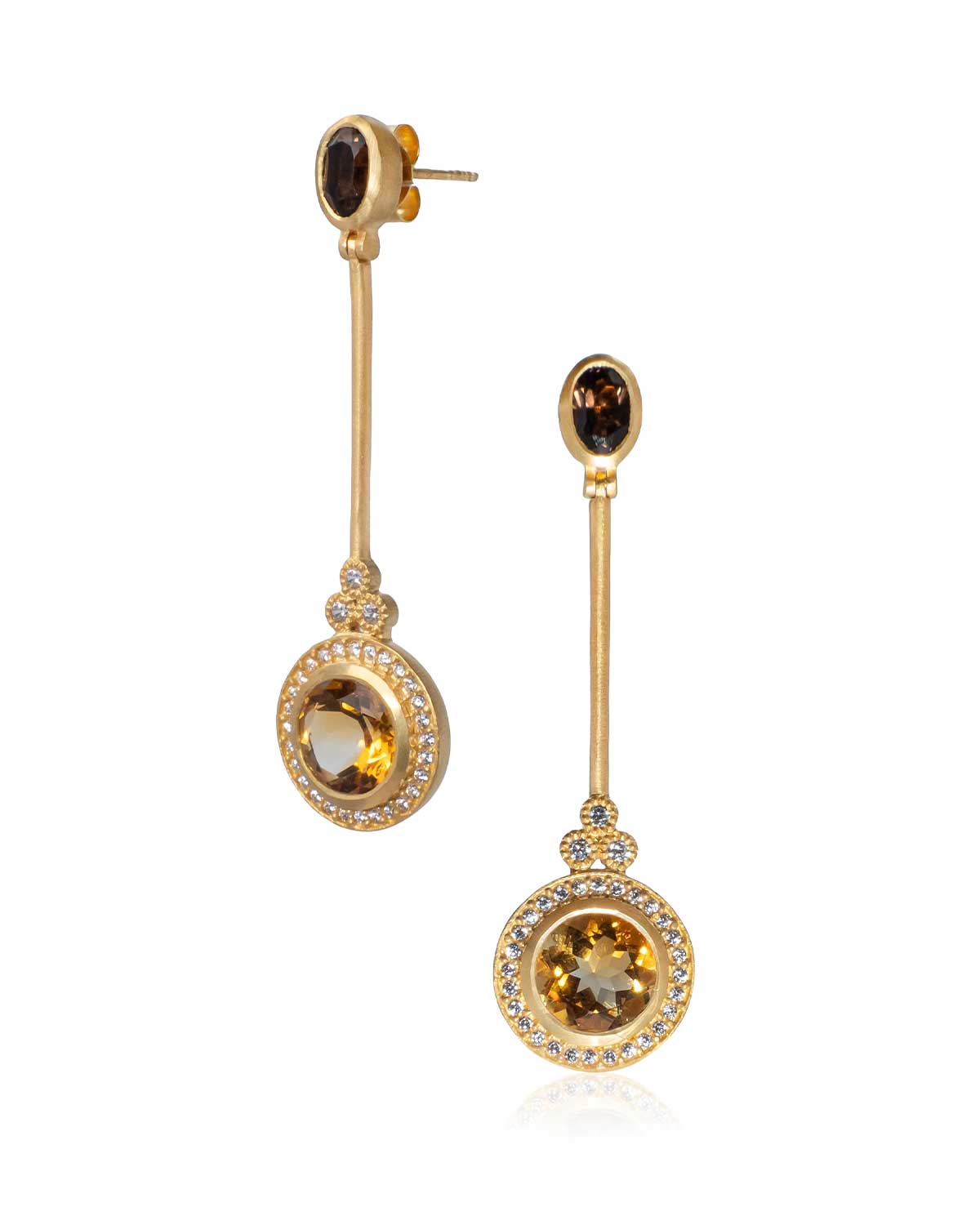 Statement gold earrings with citrine gemstones in a flowing design
