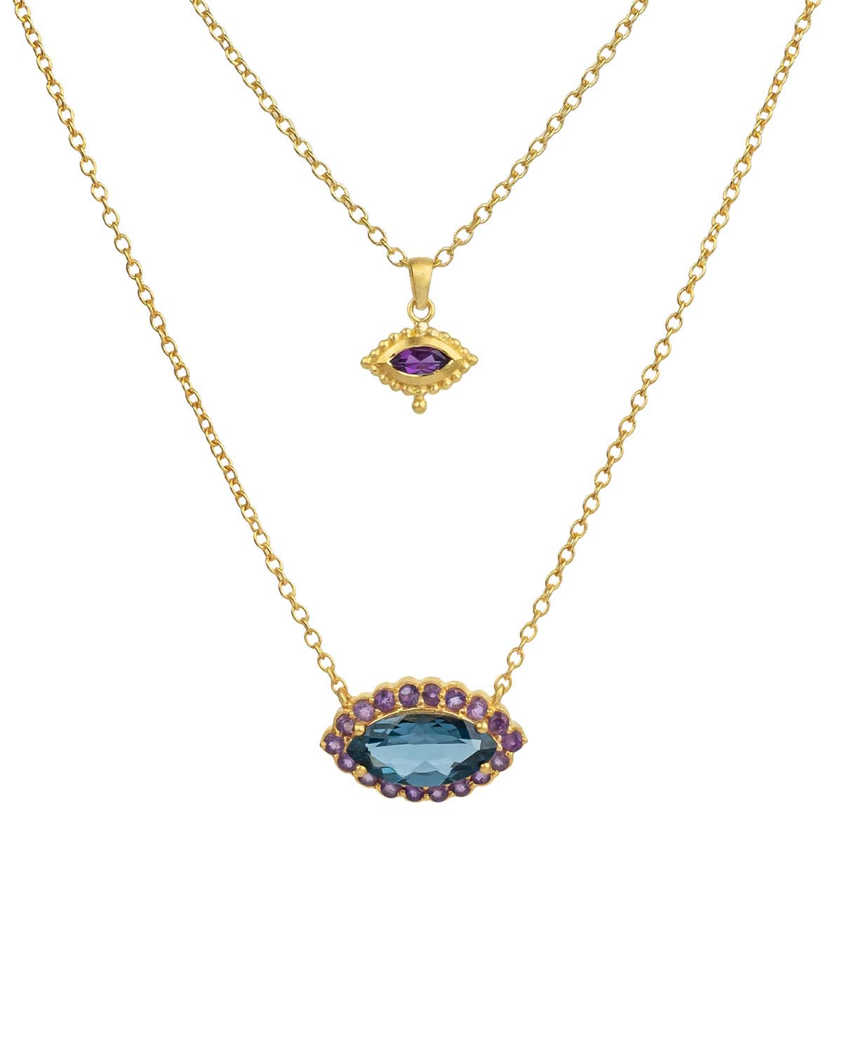 Detailed view of turquoise and rainbow moonstone in gold eye necklace