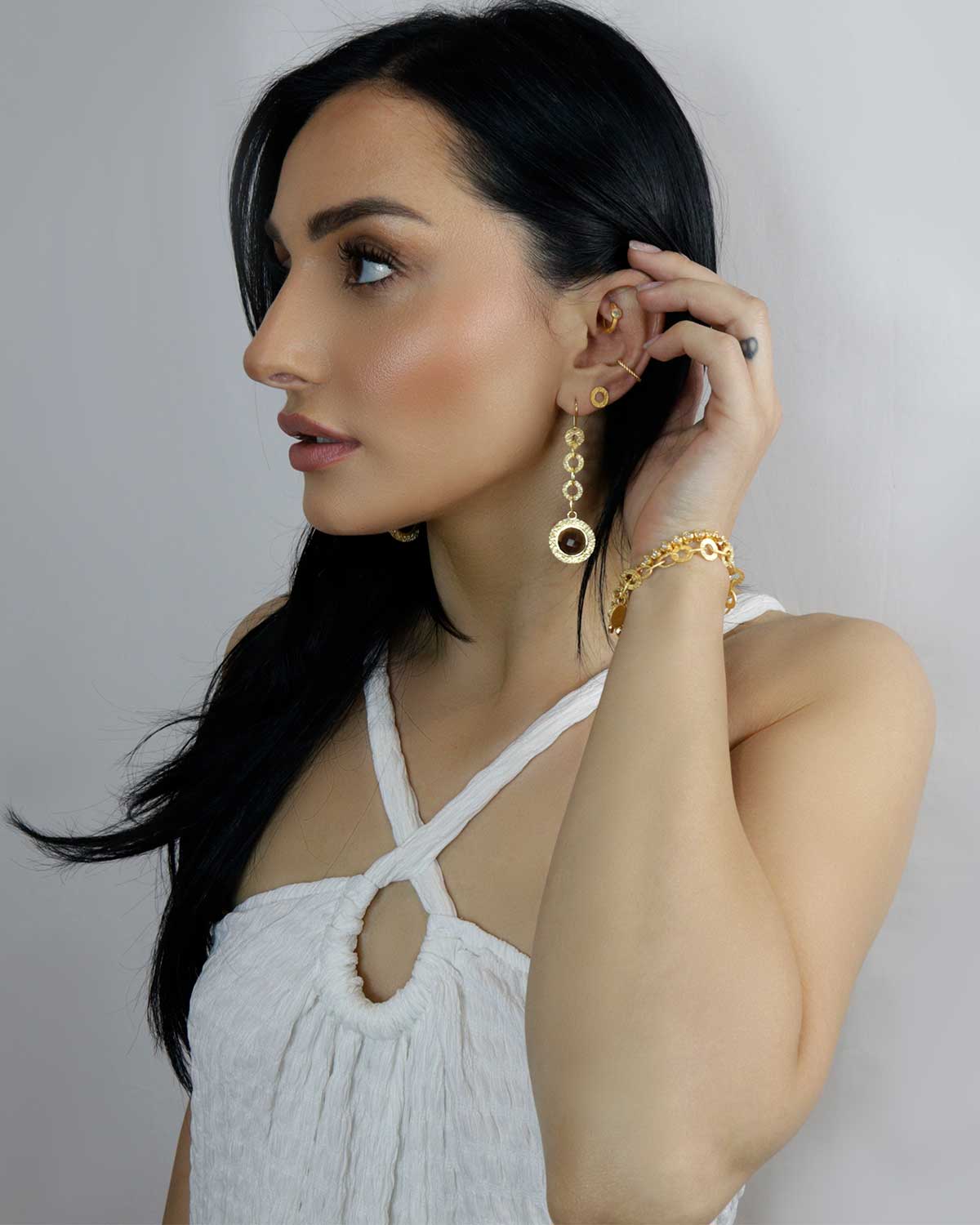 Full view of gold drop earrings with smoky quartz gemstones