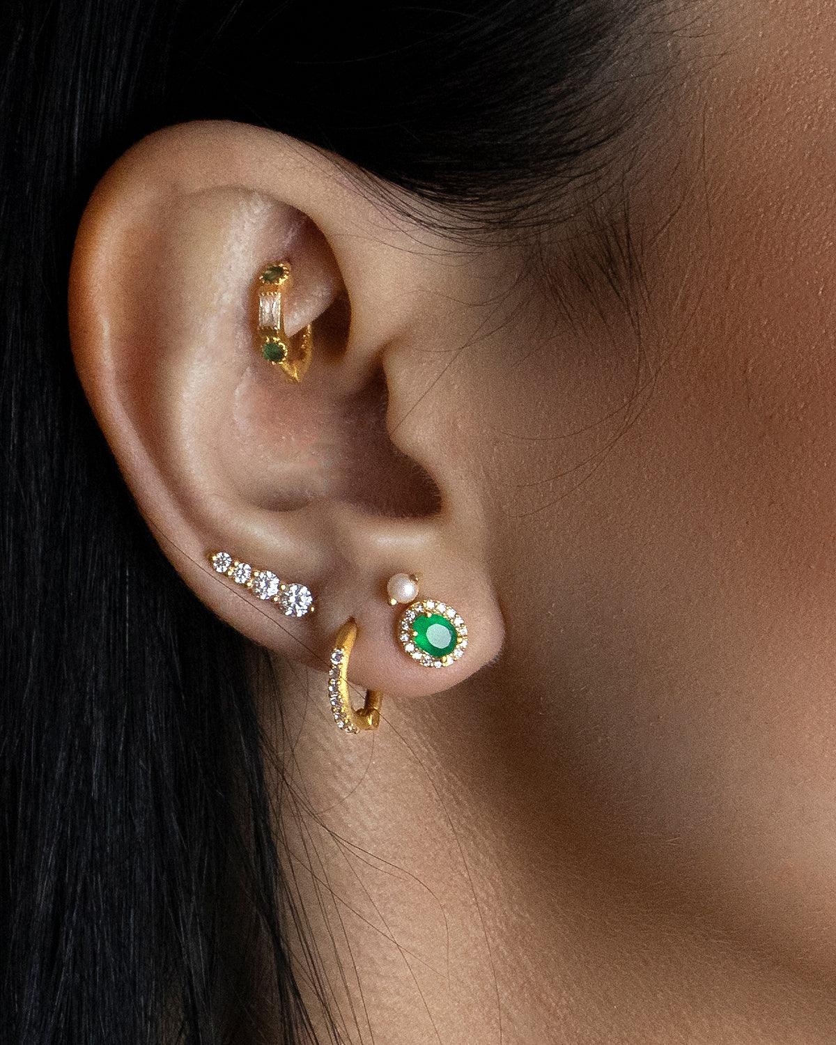 Model wearing pink tourmaline stud earrings with gold plated finish