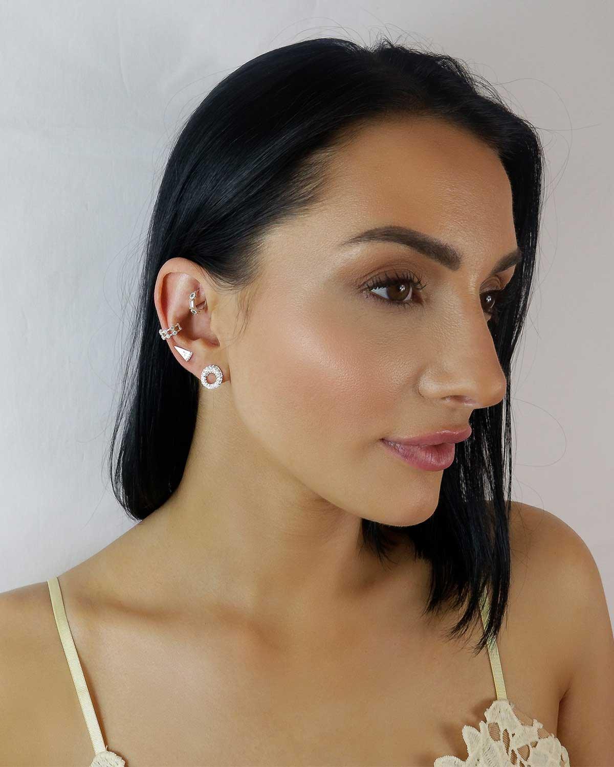 Model wearing spherical cubic zirconia silver stud earrings