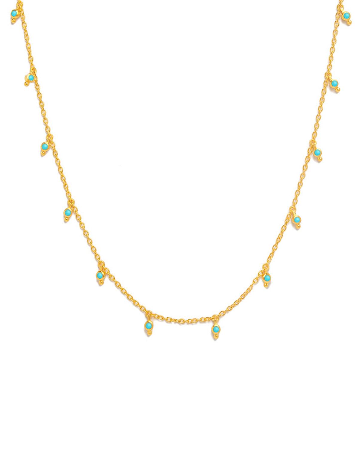Gold necklace with polished finish and turquoise gemstones