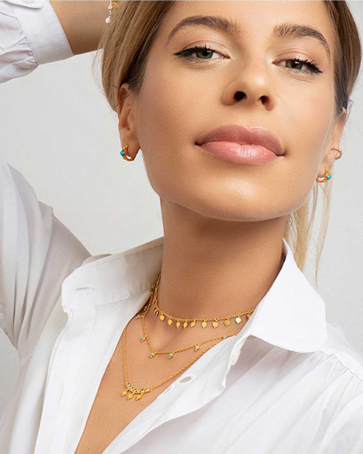 Silver necklace with turquoise gemstones designed for positive energy and style