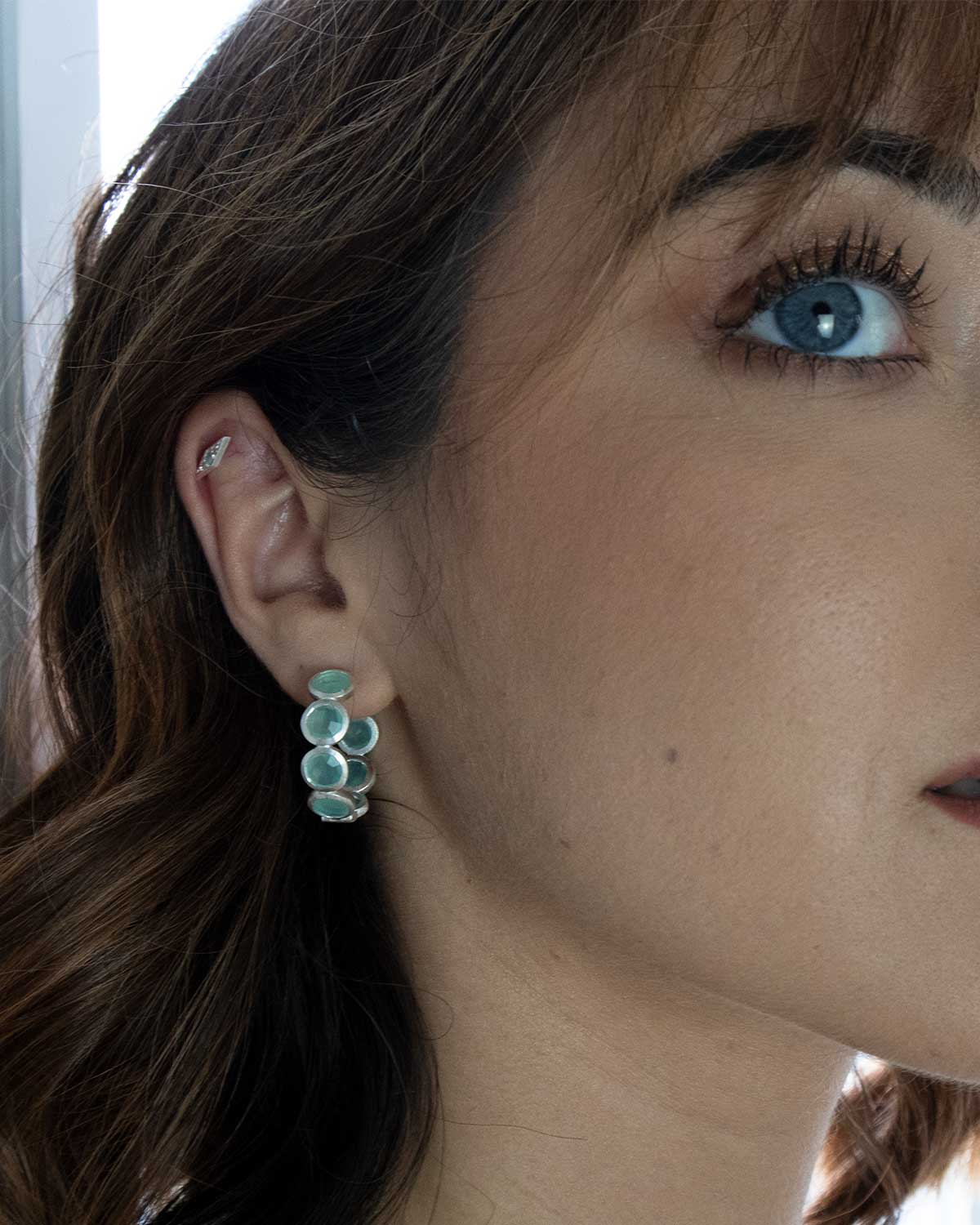 Silver hoop earrings with secure click clasp and aqua gemstones