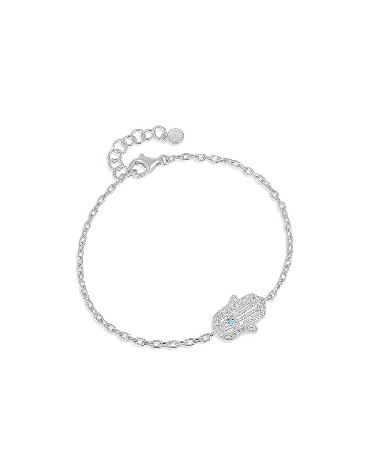 Adjustable sterling silver bracelet with a hand charm, lab diamonds, and turquoise gemstone