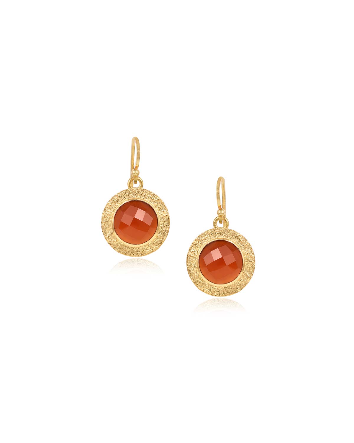 Bold gold earrings featuring circular carnelian gemstones and polished finish