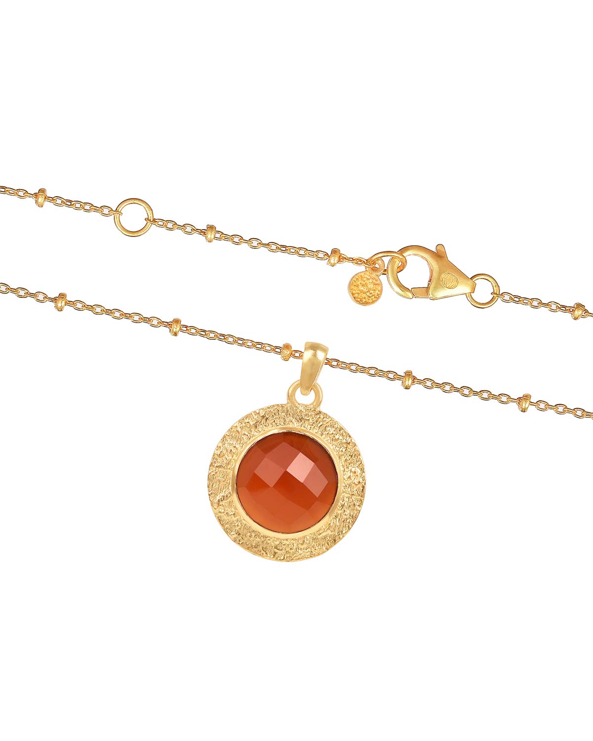 Bold gold earrings featuring circular carnelian gemstones and polished finish