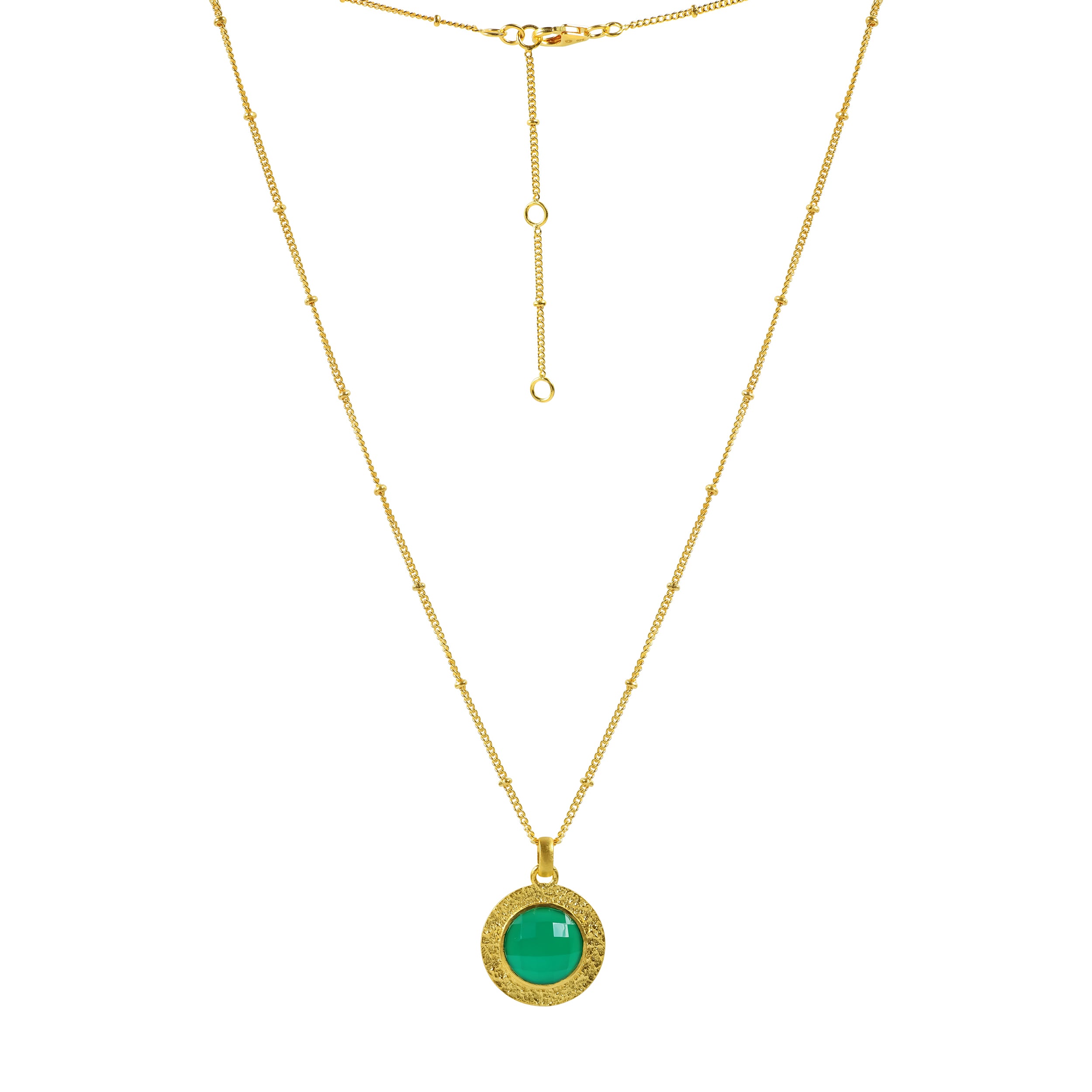 Gold necklace with circular green onyx gemstone in a bold design