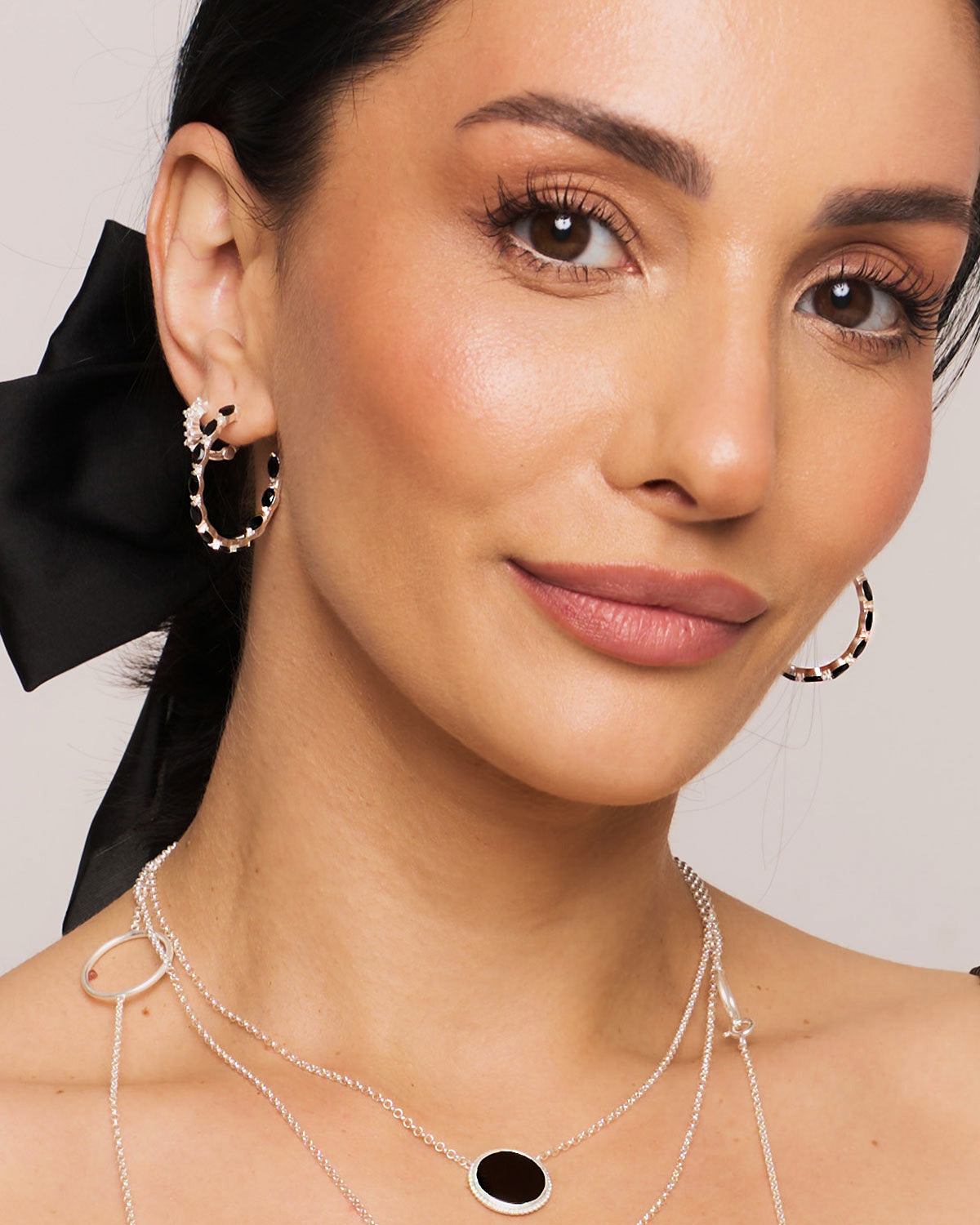 Pair of gold vermeil hoop earrings with marquise-cut black spinel gemstones