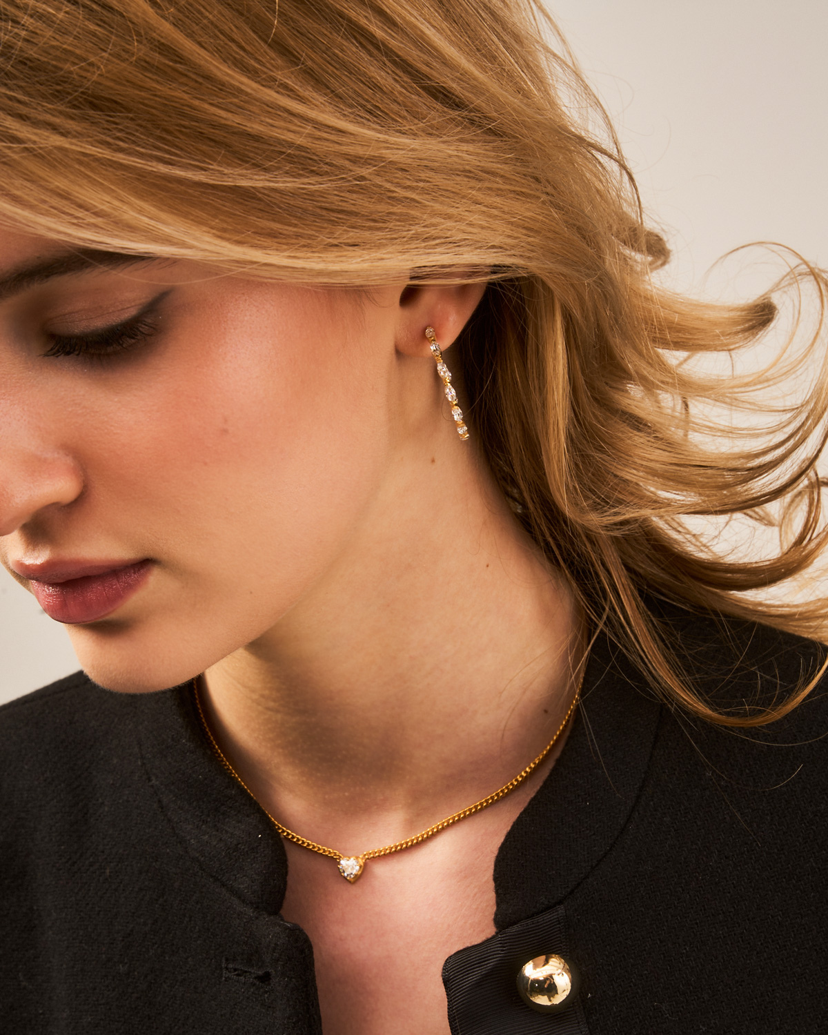 side angle of gold vermeil hoop earrings with hand-set zirconia stones