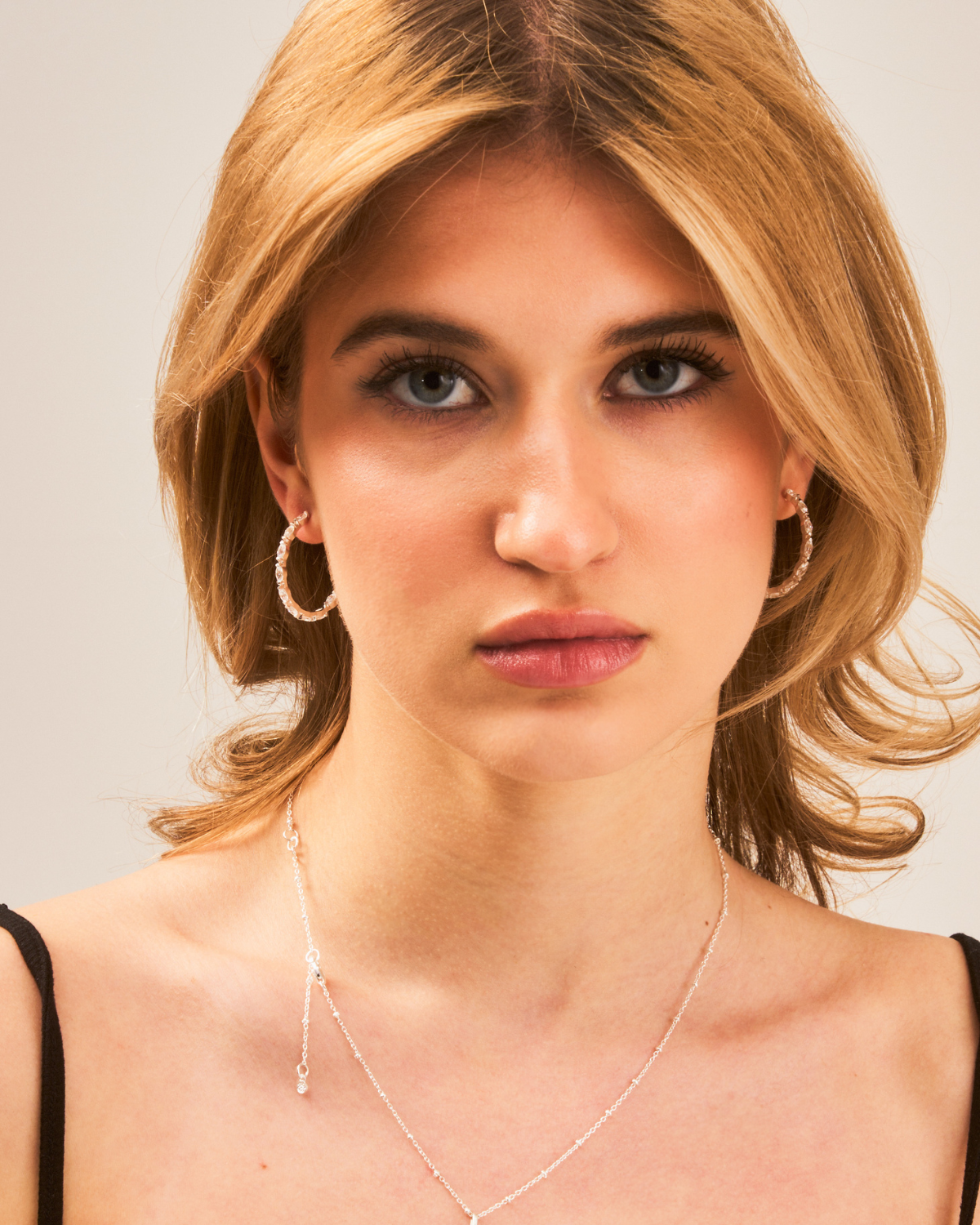 Silver hoop earrings styled with sparkling AAA zirconia marquise-cut gemstones